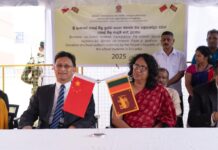 The symbolic handover ceremony of school uniforms, donated by the Chinese government