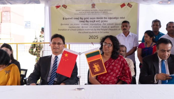 The symbolic handover ceremony of school uniforms, donated by the Chinese government